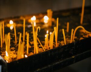 glowing candles in holy place of church