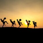 silhouette of people performing during sunset