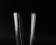 a clear drinking glass on black background