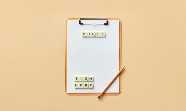 pencil and letter tiles on a clipboard